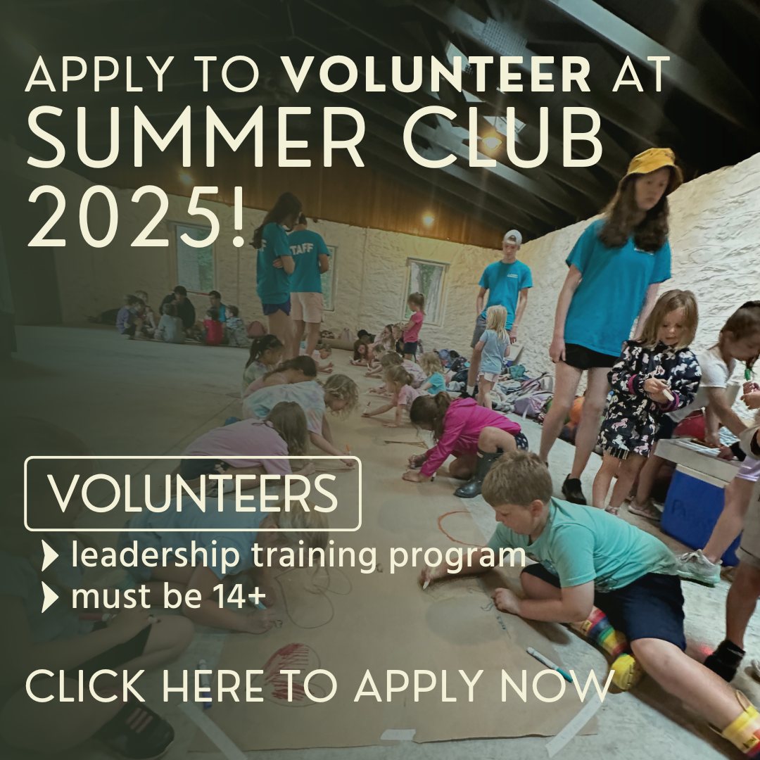 group of children coloring a large mural on the floor of a camp pavilion 