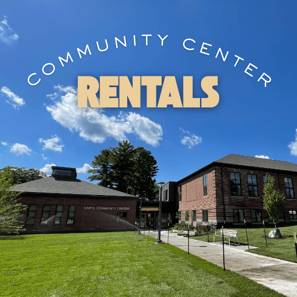Brick building under bright blue sky with text across top of image
